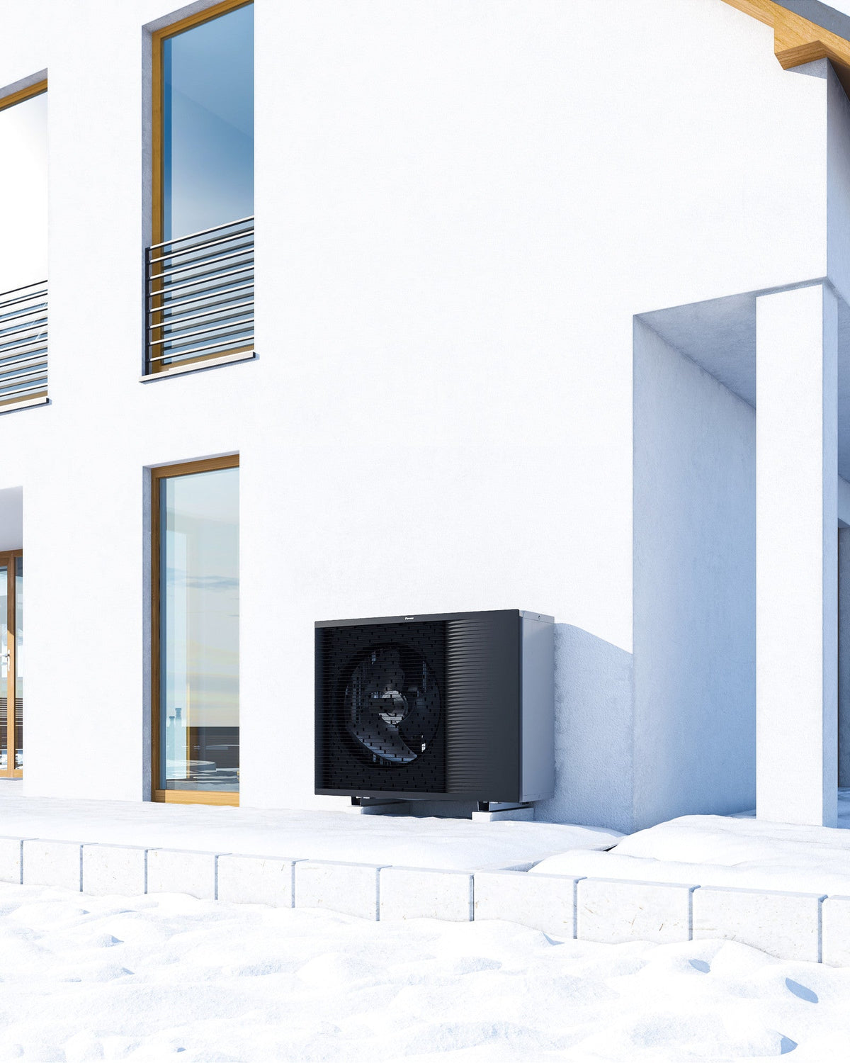DAIKIN Altherma 3 H HT vonkajšia jednotka 18 kW EPRA18DW17 — vonkajšia jednotka pri terase domu v zime
